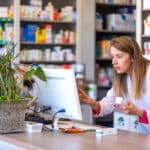 pharmacist using software to enhance patient safety
