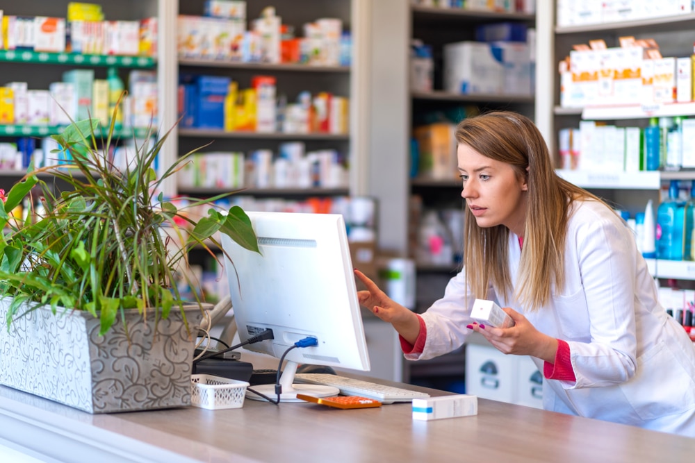 pharmacist using software to enhance patient safety