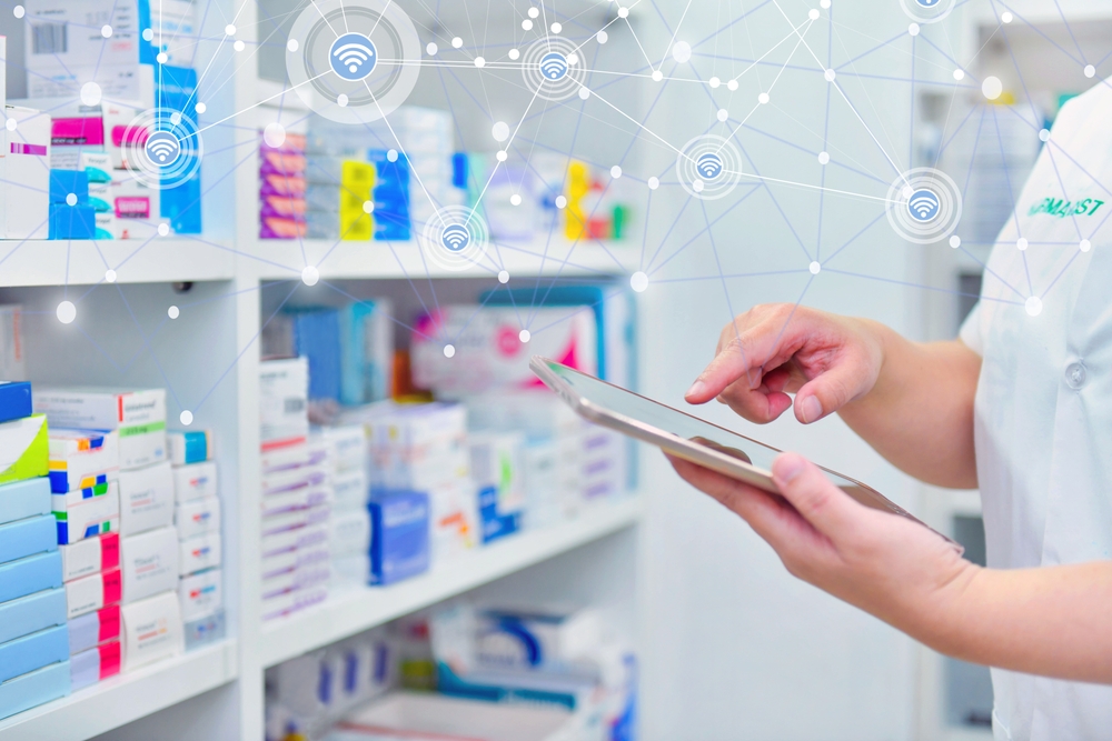 Pharmacist touching an iPad