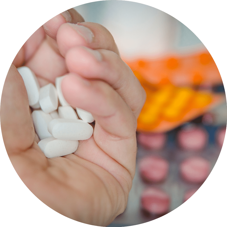 Open hand holding pharmacy pills