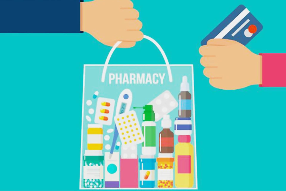 A hand is holding a pharmacy bag