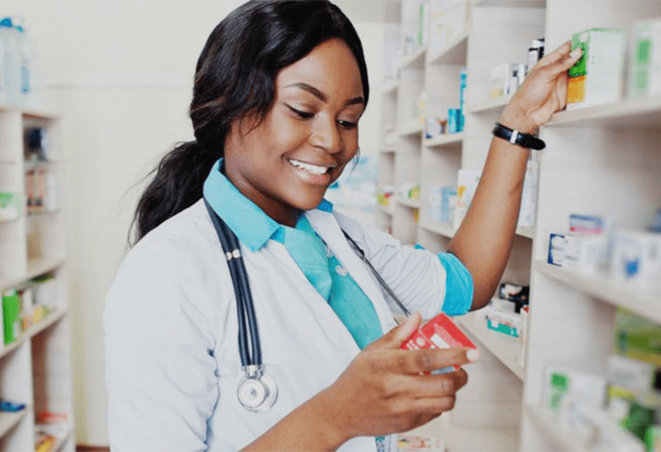 Woman putting away pharmacy items