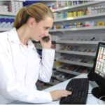 A pharmacist on the phone with software support
