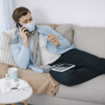 Sick man on the phone with his pharmacist using an app on his tablet