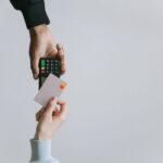 A person’s using a credit card with a POS system