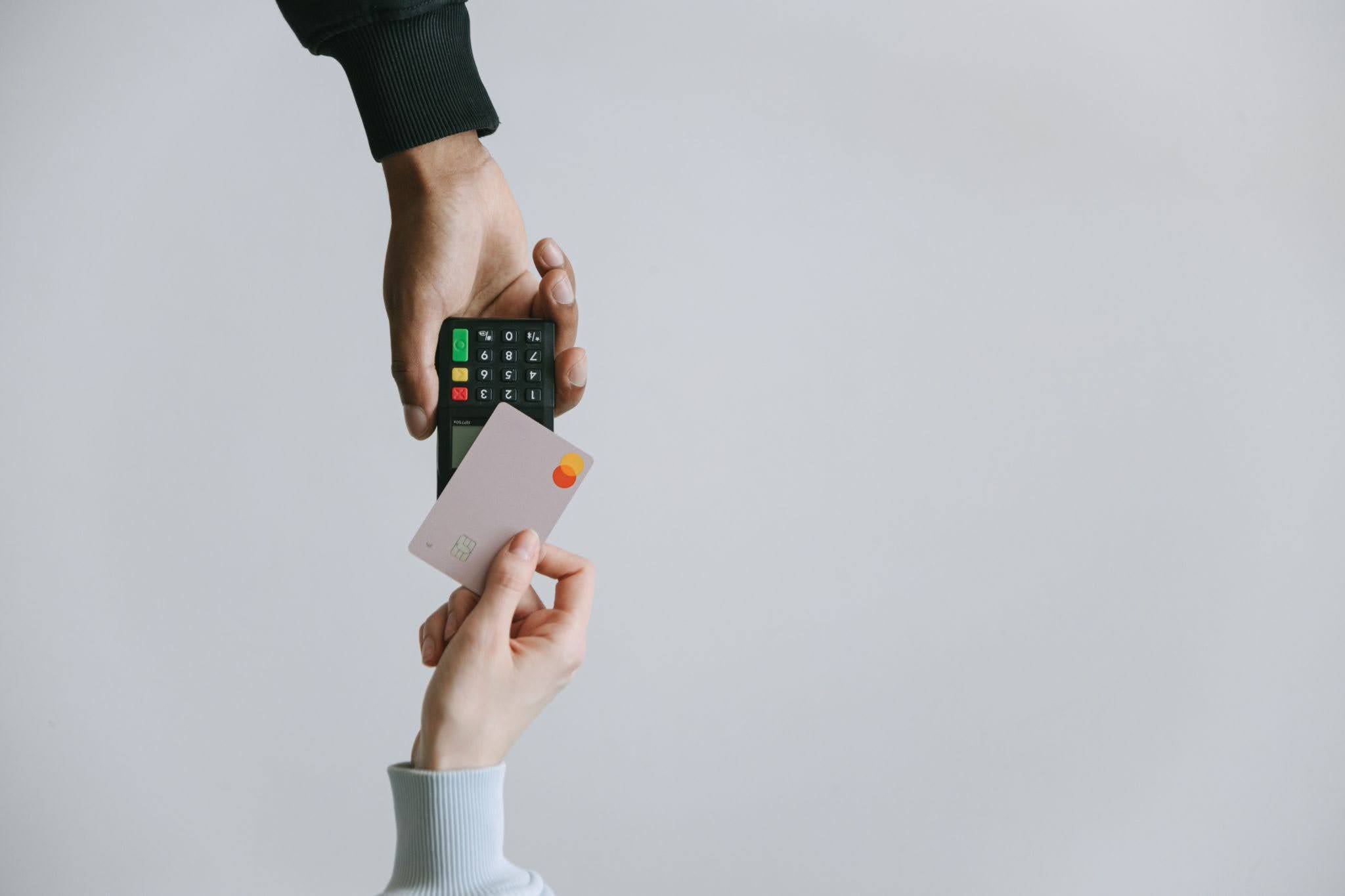 credit-card-at-pos A person’s using a credit card with a POS system