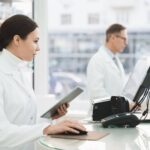Independent pharmacist comparing pharmacy software options in 2026
